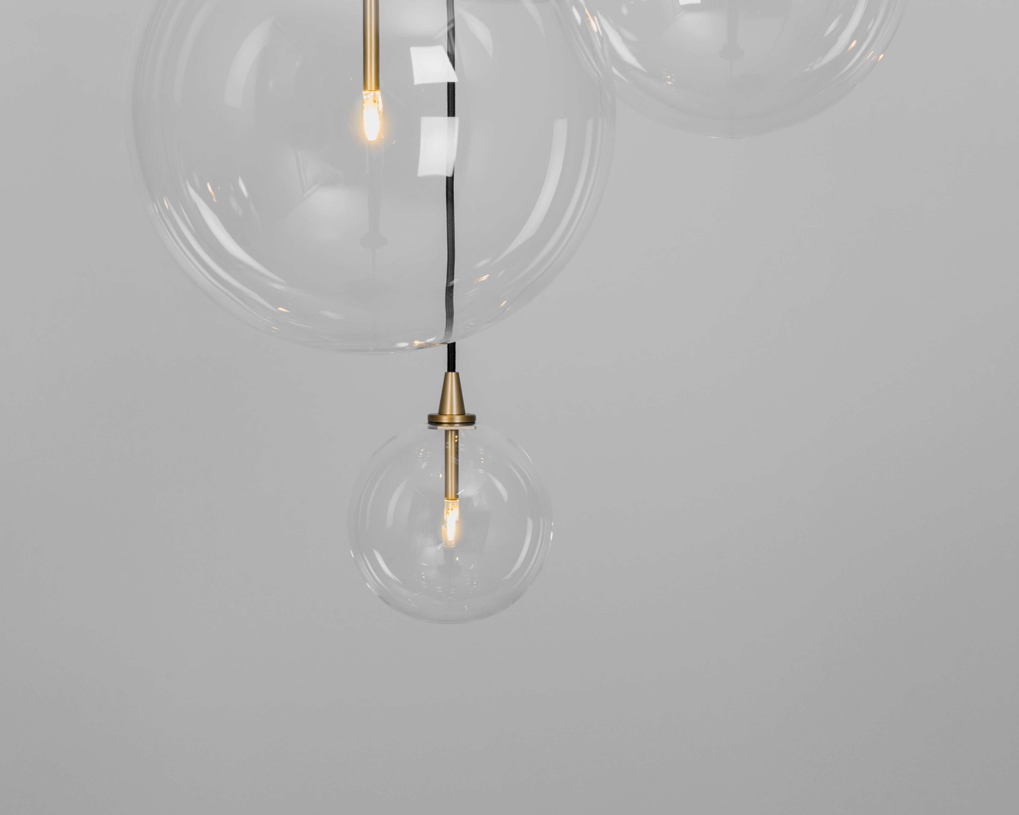 Schwung Cluster 5 Burnished Brass Transparent Globe Mix Chandelier